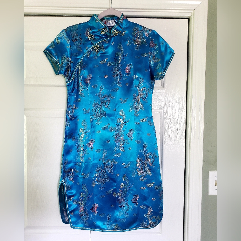 Blue dress with dragon design.
